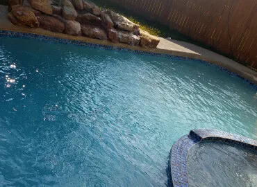 Re-tiled pool with concrete work